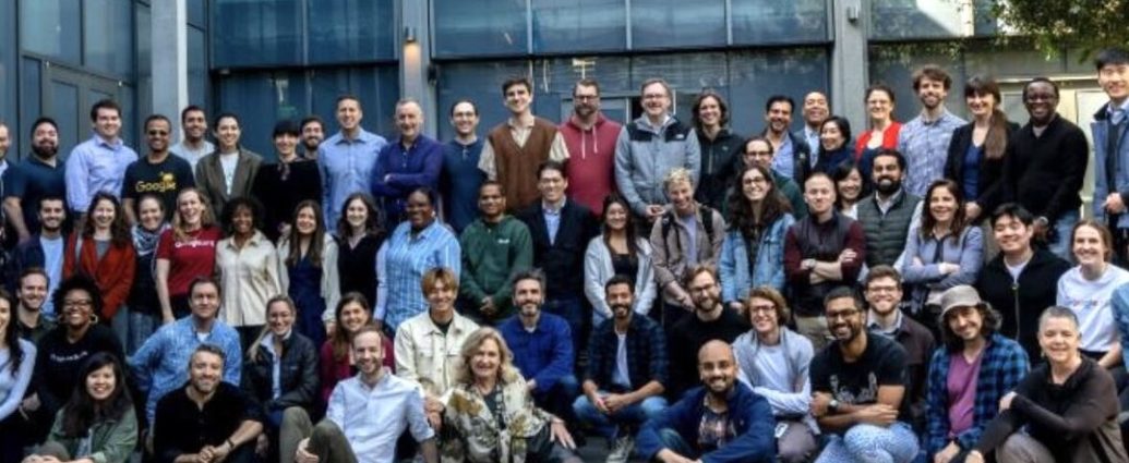 AI science funding - Scientists working with AI technology in a modern research laboratory