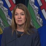 Alberta immigration address - Alberta Premier Danielle Smith speaking at a podium during a government announcement