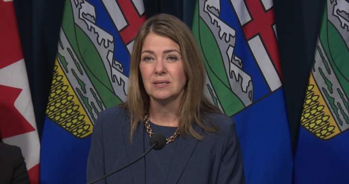 Alberta immigration address - Alberta Premier Danielle Smith speaking at a podium during a government announcement