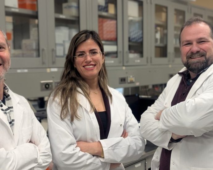 bacteria eat cancer tumours - Cancer researchers working in a laboratory with medical equipment and samples