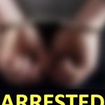 Burlington gun threats - Police officer making an arrest with handcuffs visible