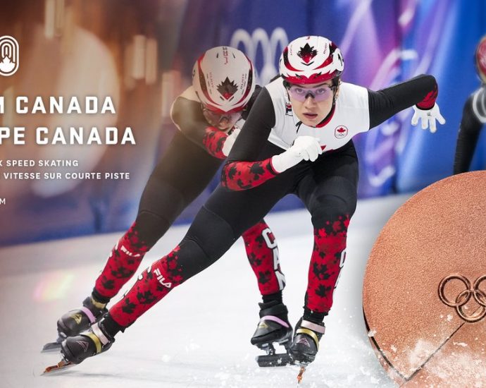 Canada bronze Olympic relay - Short track speed skaters racing around an oval ice track during a relay competition