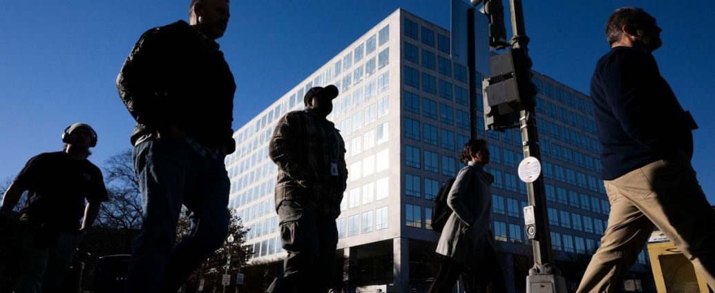 federal workers return to office - Empty office workstations in a government building showing the workspace shortage challenge