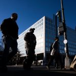 federal workers return to office - Empty office workstations in a government building showing the workspace shortage challenge