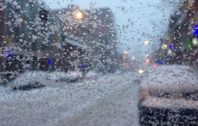 freezing drizzle waterloo - Icy road conditions with freezing rain coating pavement and vehicles