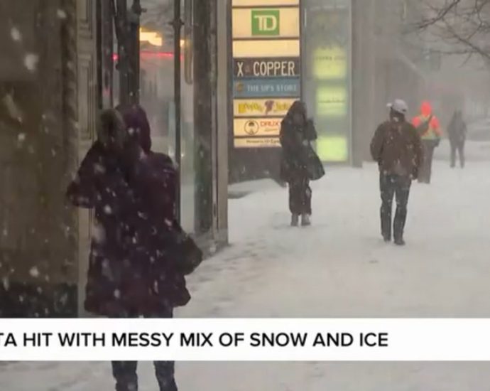 GTA winter storm - Cars driving through freezing rain and snow during a winter storm in Toronto