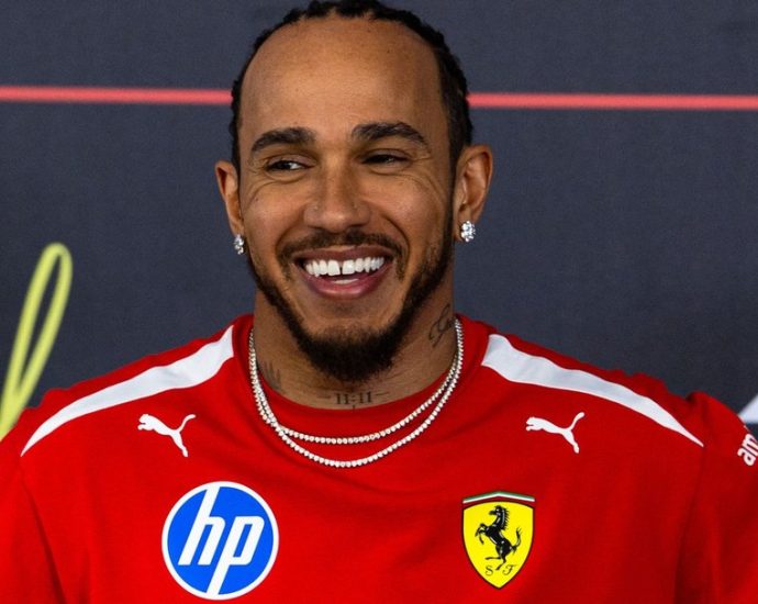 Hamilton Ferrari 2026 - Lewis Hamilton in Ferrari red racing suit during 2026 Formula 1 pre-season testing