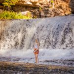 Hamilton hiking trails - Person hiking on trail near Webster's Falls in Hamilton with scenic waterfall view