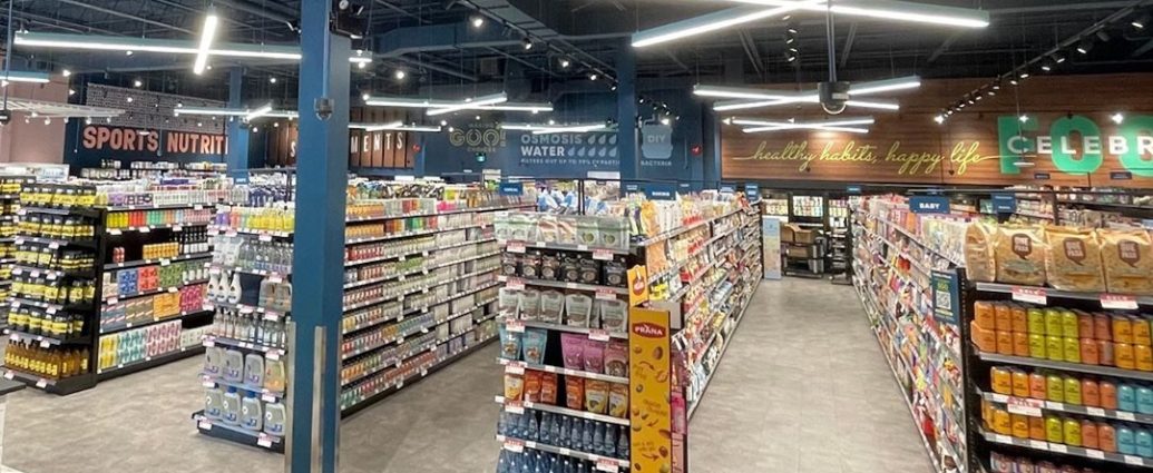 Healthy Planet Toronto store - Interior of a modern health and wellness retail store with shelves of supplements and organic products