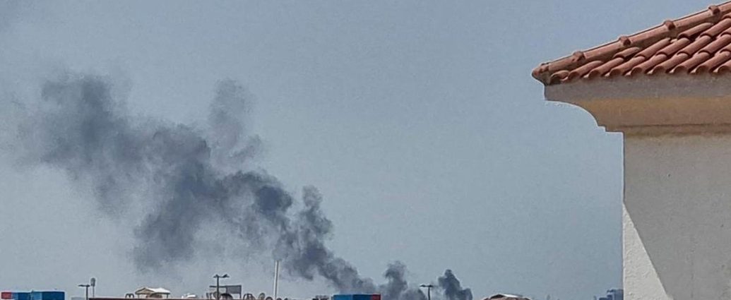 Iran strikes US bases - Military base under attack with smoke and explosions