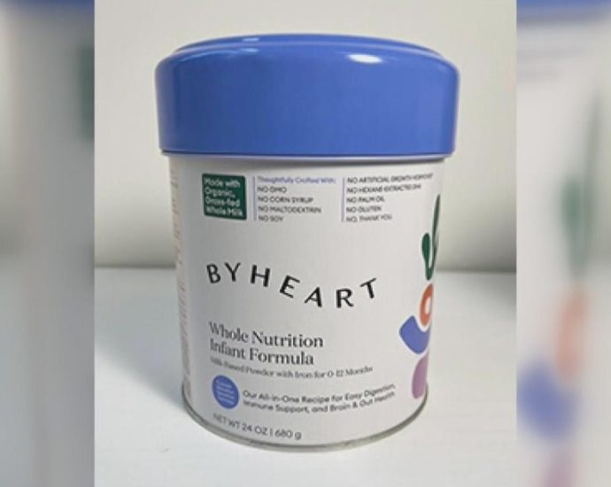 Kendamil formula recall - Baby formula containers on store shelf with recall notice