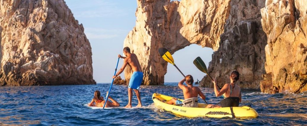 Los Cabos flights - Scenic view of Los Cabos beach with clear blue water and rocky formations