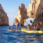 Los Cabos flights - Scenic view of Los Cabos beach with clear blue water and rocky formations