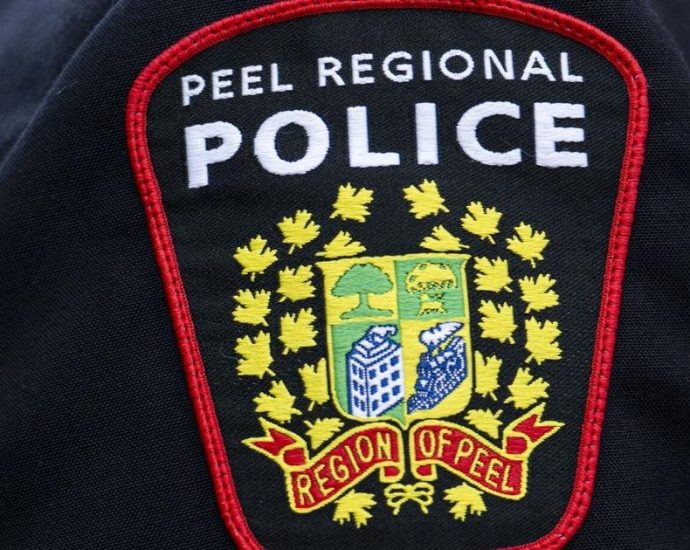 Mississauga police shooting - Police vehicles and investigators at a crime scene in Mississauga