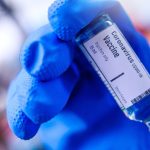 mRNA vaccine questions - Medical researcher working with mRNA vaccine samples in laboratory setting
