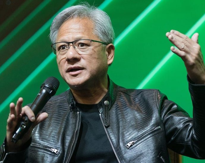 Nvidia earnings stock market - Stock market trading floor with multiple screens showing financial data and market movements