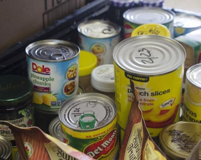 Oakville food banks - Volunteers organizing food donations at a community food bank