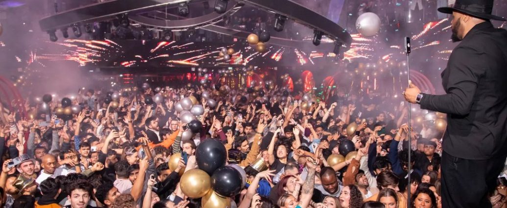 Rebel nightclub phone theft - Security personnel checking bags at nightclub entrance