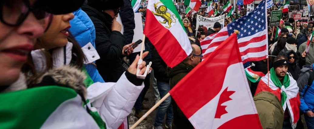 Richmond Hill Iranian march - Crowd of protesters marching with Iranian flags and solidarity signs