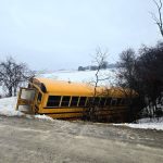 school bus crash - Emergency responders attending to a school bus incident scene