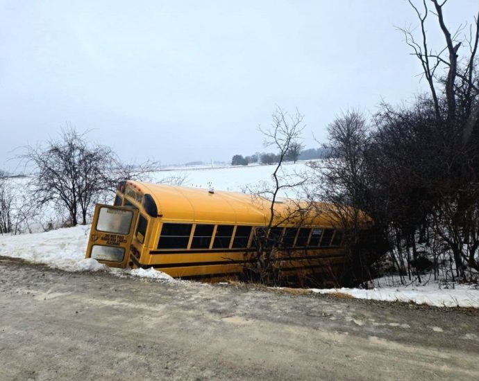school bus crash - Emergency responders attending to a school bus incident scene