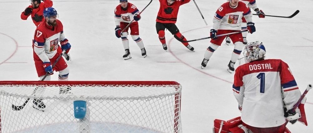Team Canada Czechia game - Team Canada hockey players celebrating on ice after victory