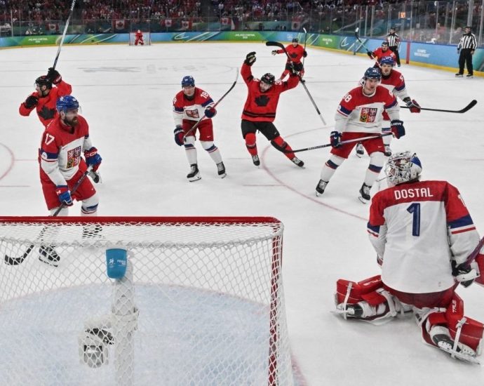 Team Canada Czechia game - Team Canada hockey players celebrating on ice after victory