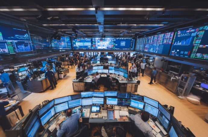 tech stocks rally - Stock market trading screens showing green numbers and upward trending charts