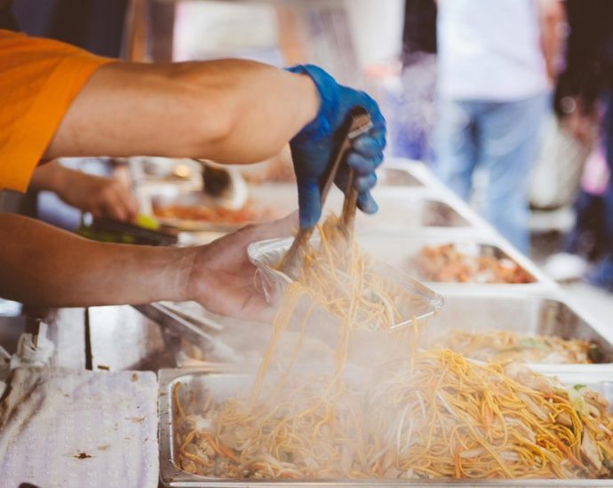 Toronto food festival - Outdoor food festival with vendors and people sampling dishes