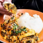 West African restaurants Toronto - Colorful West African dishes including jollof rice and grilled meat served at a Toronto restaurant