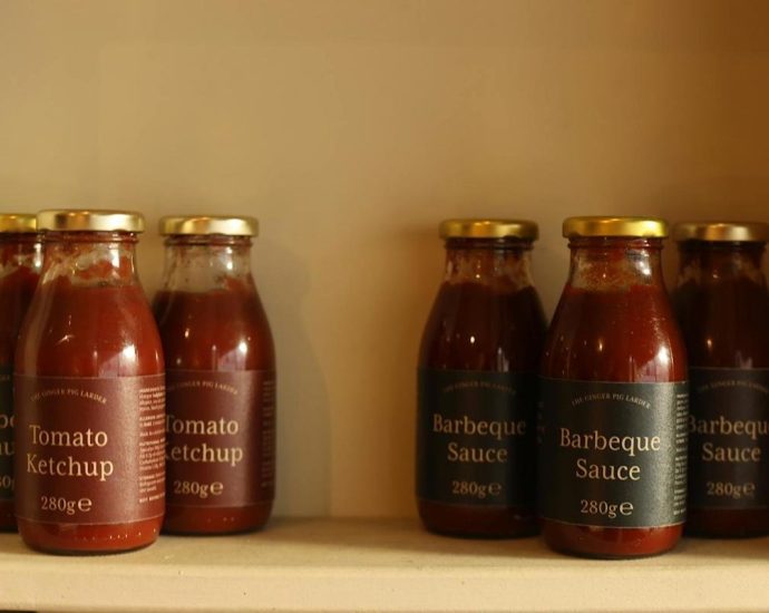 BBQ sauce recall - Glass bottle of BBQ sauce with orange label on kitchen counter