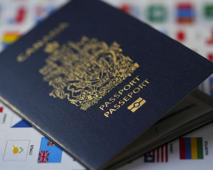 Canada travel warnings - Canadian passport on a world map highlighting Middle Eastern countries under travel advisory