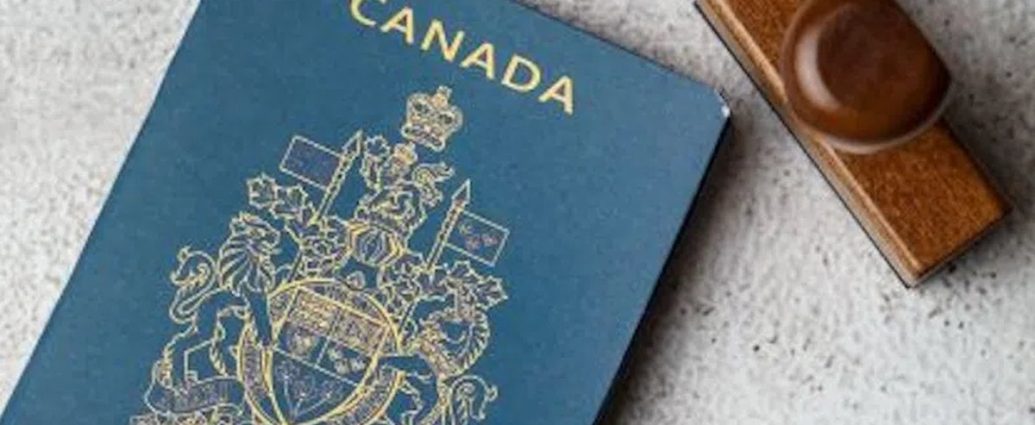 Canadian passport fees - Canadian passport and application documents on a desk