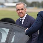 Carney Iran strikes - Mark Carney speaking at a podium about Canadian foreign policy decisions