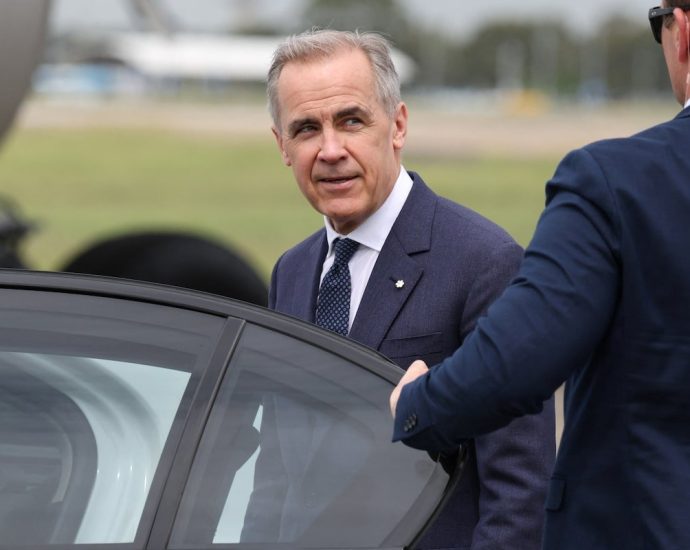 Carney Iran strikes - Mark Carney speaking at a podium about Canadian foreign policy decisions