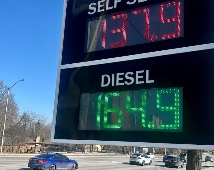 gas prices Canada - Gas station price display showing elevated fuel costs