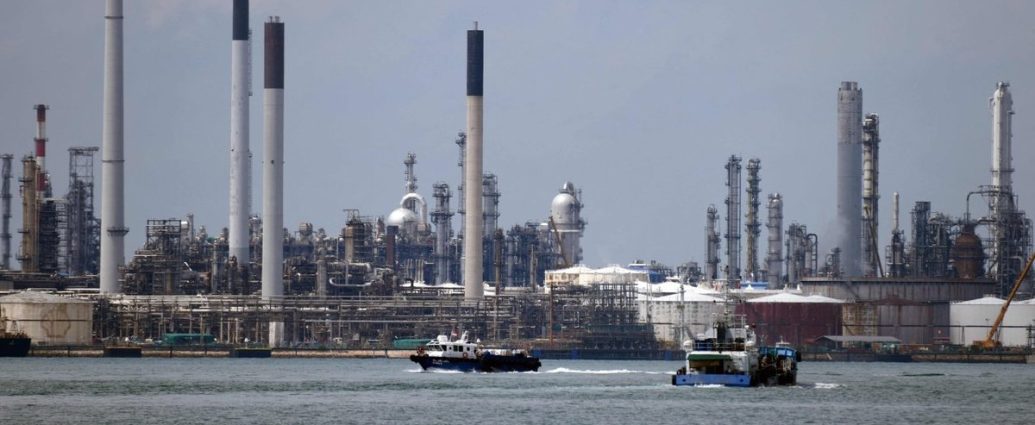gas prices spike - Gas pump display showing rising fuel prices amid Middle East conflict