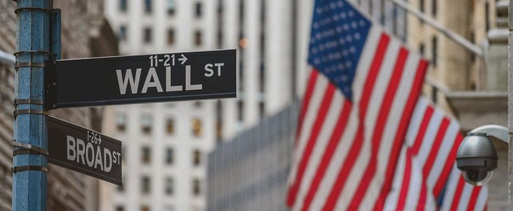 stock market today - Stock market trading floor with electronic displays showing market gains