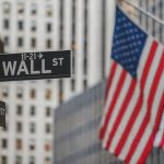 stock market today - Stock market trading floor with electronic displays showing market gains