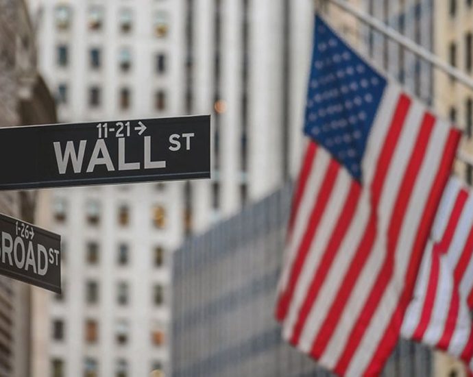 stock market today - Stock market trading floor with electronic displays showing market gains