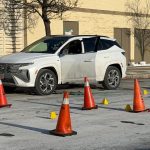 Toronto police shootings - Police officers investigating a crime scene with evidence markers