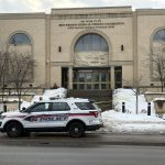 Toronto synagogue attacks - Police investigating outside a synagogue with damaged windows