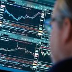 Trump tariffs Canadian stocks - Stock market trading screens showing Canadian financial data and investment charts