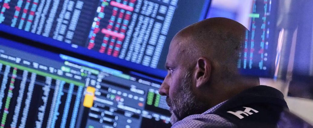 US stock market crash - Stock market trading floor with red declining charts showing market crash