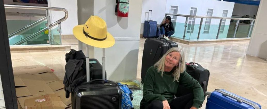 WestJet Puerto Vallarta - Passengers waiting at airport departure gate with luggage