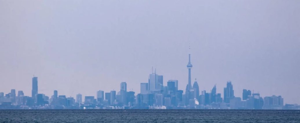 winter air quality warning - Hazy city skyline showing poor air quality conditions over urban area