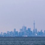 winter air quality warning - Hazy city skyline showing poor air quality conditions over urban area