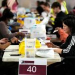April 13 byelections - Canadian voters casting ballots at a polling station during a federal byelection