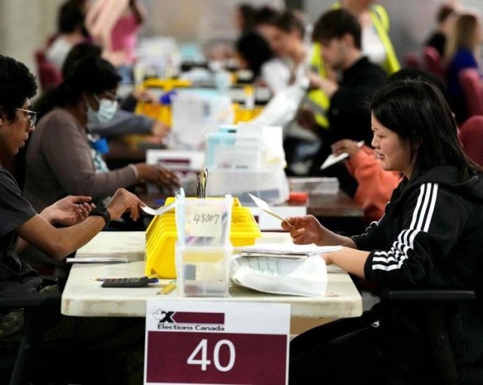 April 13 byelections - Canadian voters casting ballots at a polling station during a federal byelection