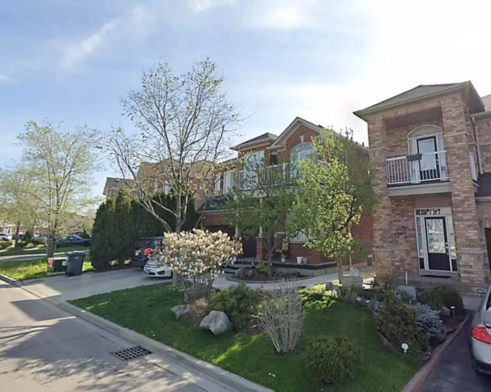 Brampton shooting - Police officers investigating a crime scene with yellow tape